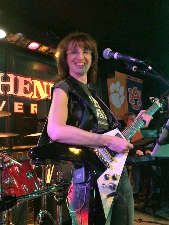 Vicki playing guitar